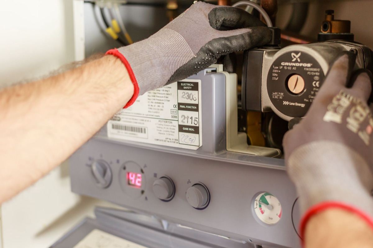 Appliance repair technician at work